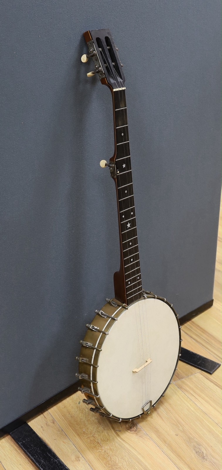 A cased Reliance banjo, 88cms long